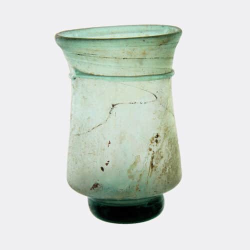Roman Antiquities - Byzantine or Coptic glass cup with a solid pad foot
