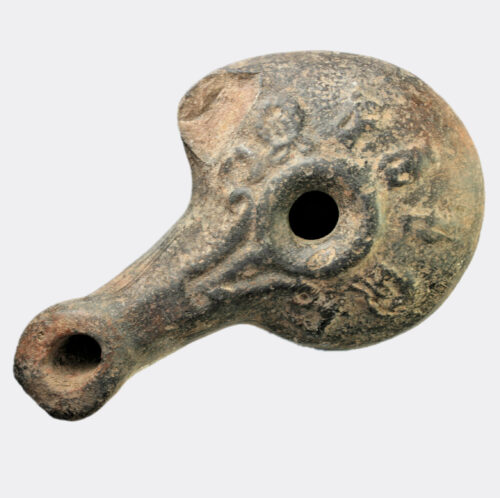 Hellenistic moulded pottery oil lamp