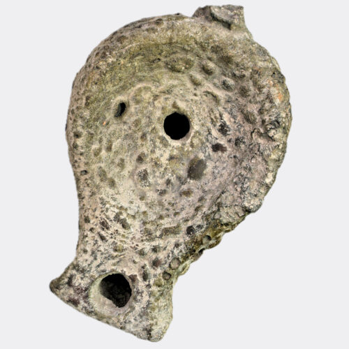 Hellenistic oil lamp with vitrified surface