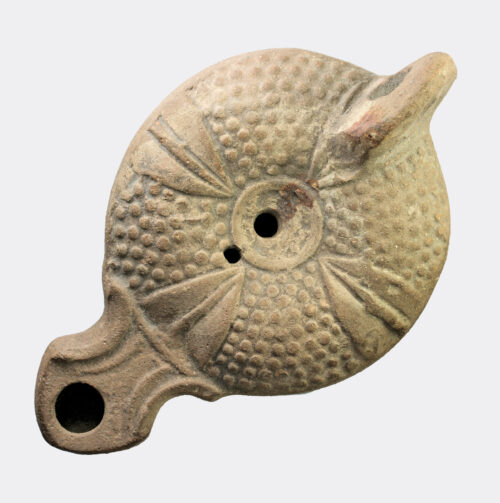 Roman pottery oil lamp with quatrefoil pattern