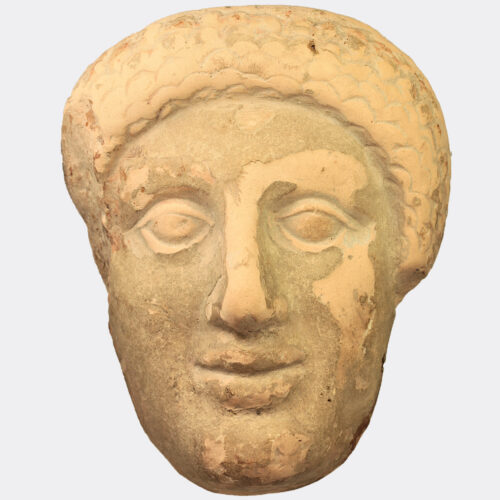 Greek terracotta votive head fragment, published and exhibited