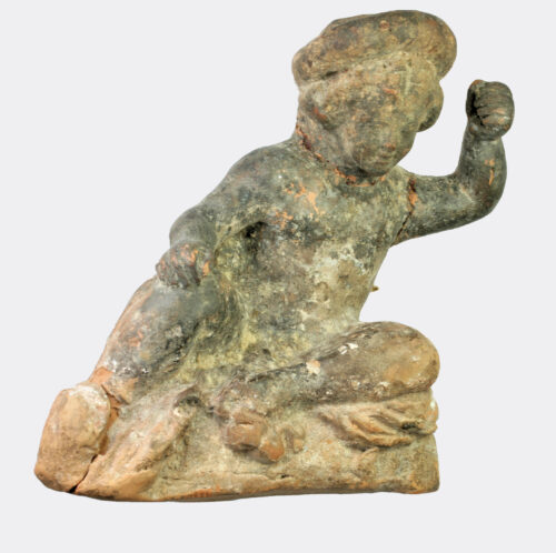 Greek Hellenistic terracotta figure of a seated youth
