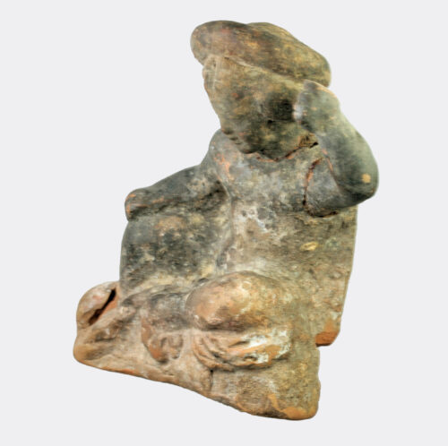 Greek Hellenistic terracotta figure of a seated youth