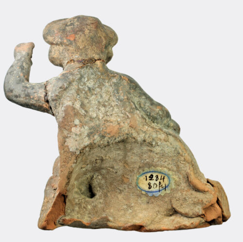Greek Hellenistic terracotta figure of a seated youth