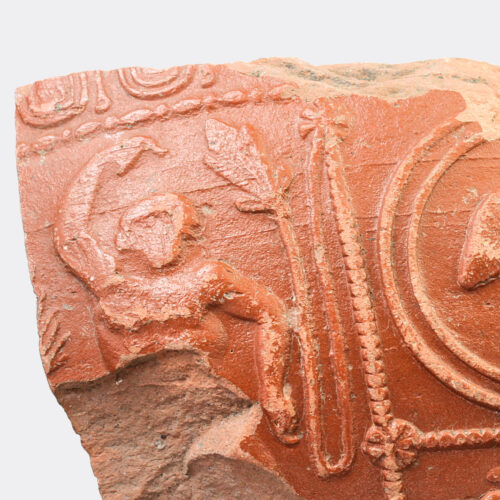 Roman Samian ware fragment with eagle and figures