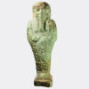 A pale green glazed faience shabti figure of squat form with moulded details and three horizontal lines of inscription on the body.

Culture:
Egypt, Late Dynastic Period, 730-332 BC

Size:
8.7 x 3.3 cms

Condition:
A few minor surface chips and a neat repair on the lower legs

Provenance:
Ex. collection Ms McLaughlin, Mytholmroyd, West Yorkshire, UK; gifted by her father (Mr Barnes, W. Yorks., UK) who acquired from older collections within the UK during the mid to late 20th Century including items originating from the Egypt Exploration Fund (EEF)